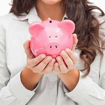 woman holding a piggy bank