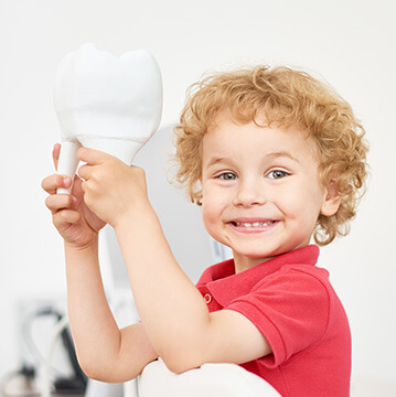 little boy with giant tooth