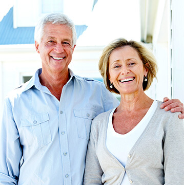 husband and wife seniors smiling